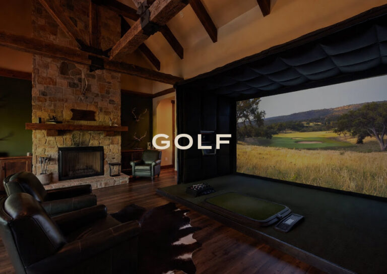 Golf: a lounge with a stone fireplace and an indoor golf simulator overlooking a fairway