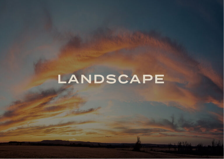 Landscape: fiery orange clouds across a Texas sunset sky